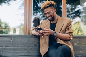 man reading text on cell phone
