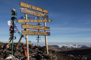 signs pointing up a mountain