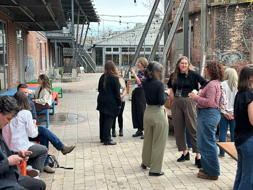 Image of ENCC Toronto attendees outside at Evergreen Brickworks, April 2026