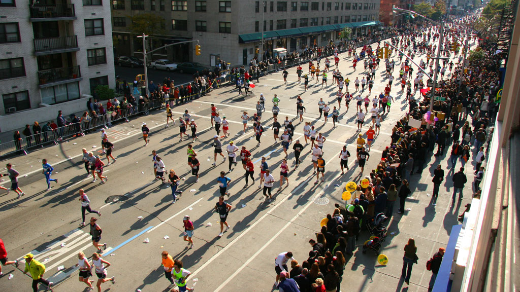 Illustrative photo of a crowd running a marathon during a community event 